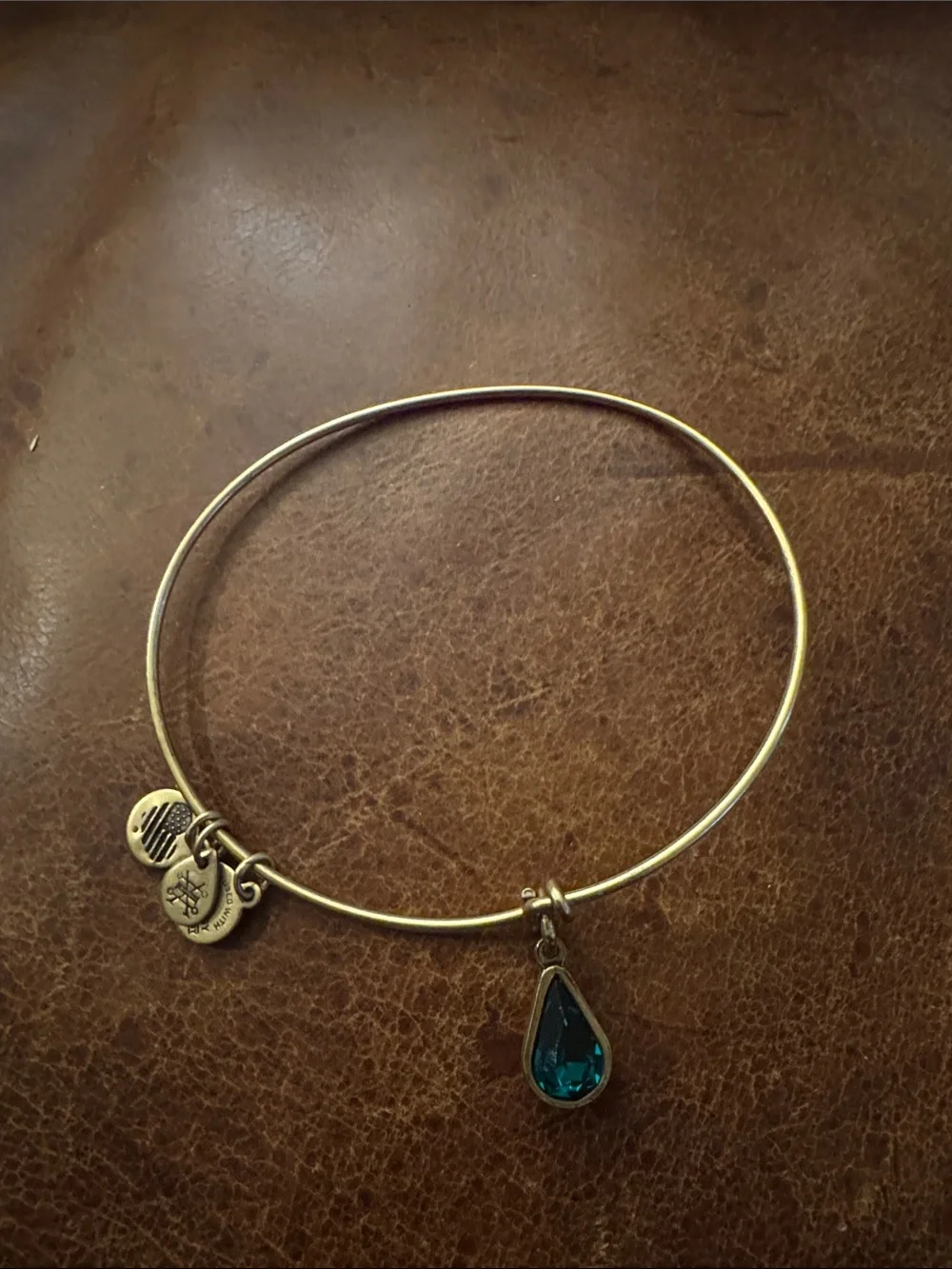 Gold-Tone Bangle Bracelet with Teardrop Blue Crystal Charm
